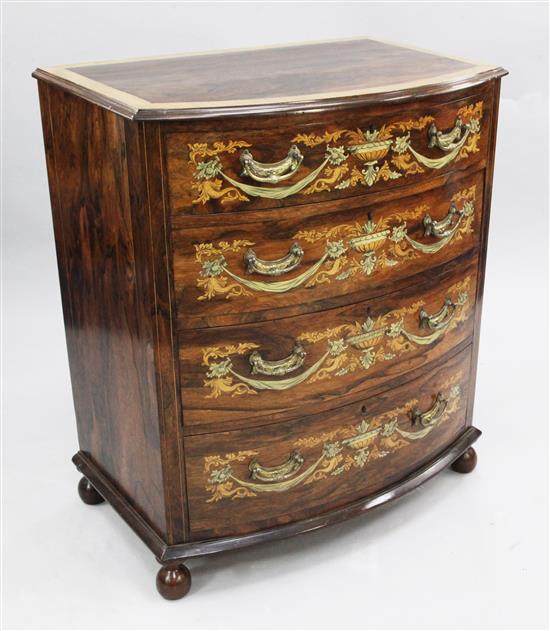 An Edwardian marquetry inlaid rosewood bowfront chest, W.2ft 10in. H.3ft 4in. D.1ft 10in.